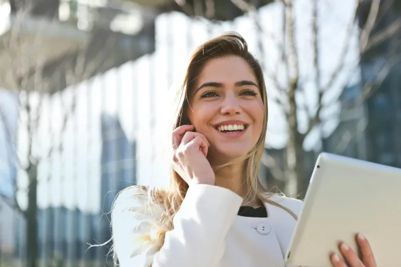 Businesswoman optimizing workflows with mobile technology outdoors